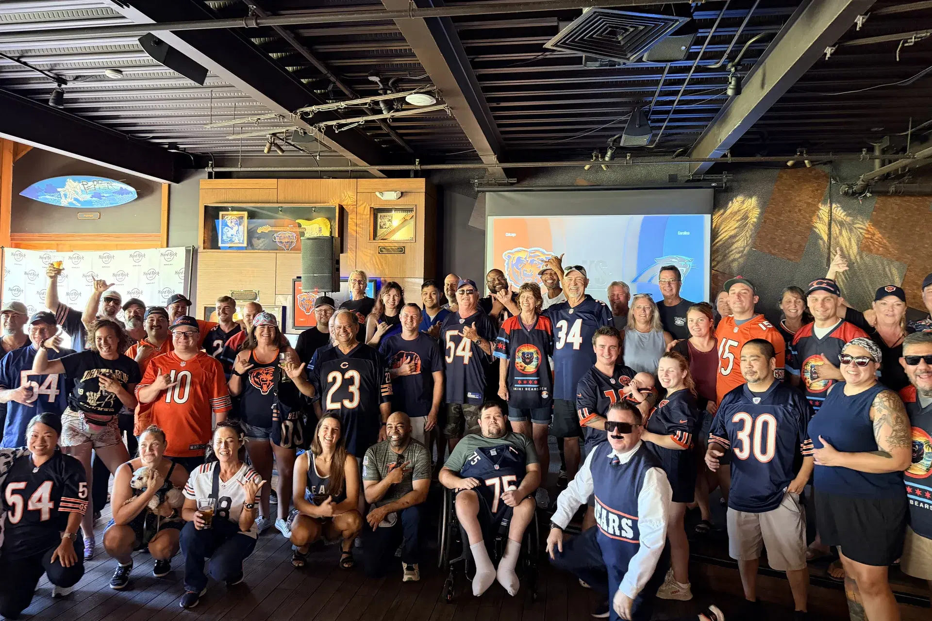 Packed Bears crowd at Hard Rock Cafe Waikiki with a fan in a Mike Ditka costume — Bears 59, Panthers 37